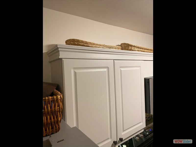 Added crown molding to kitchen cabinets